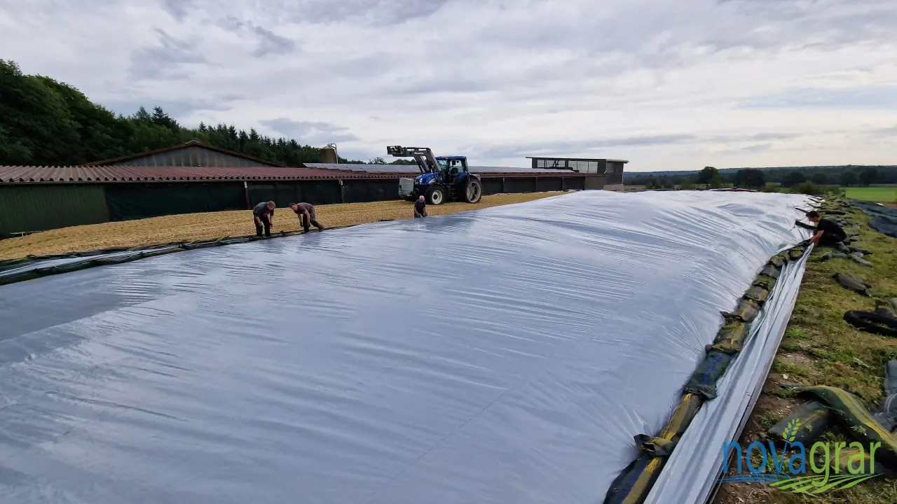 Workers install V12 Silver Cover on a silage clamp